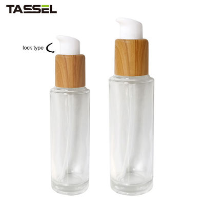30ml 50ml Round Glass Bottle With Wooden Effect Treatment Pump Lock Type